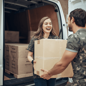Delivery of furniture with a smiling customer receiving a van delivery, delivery person unloading furniture from delivery van, happy customer at doorway, professional delivery service scene-1